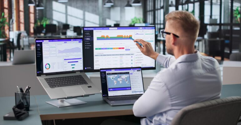 SEO specialist analyzing website performance on a laptop